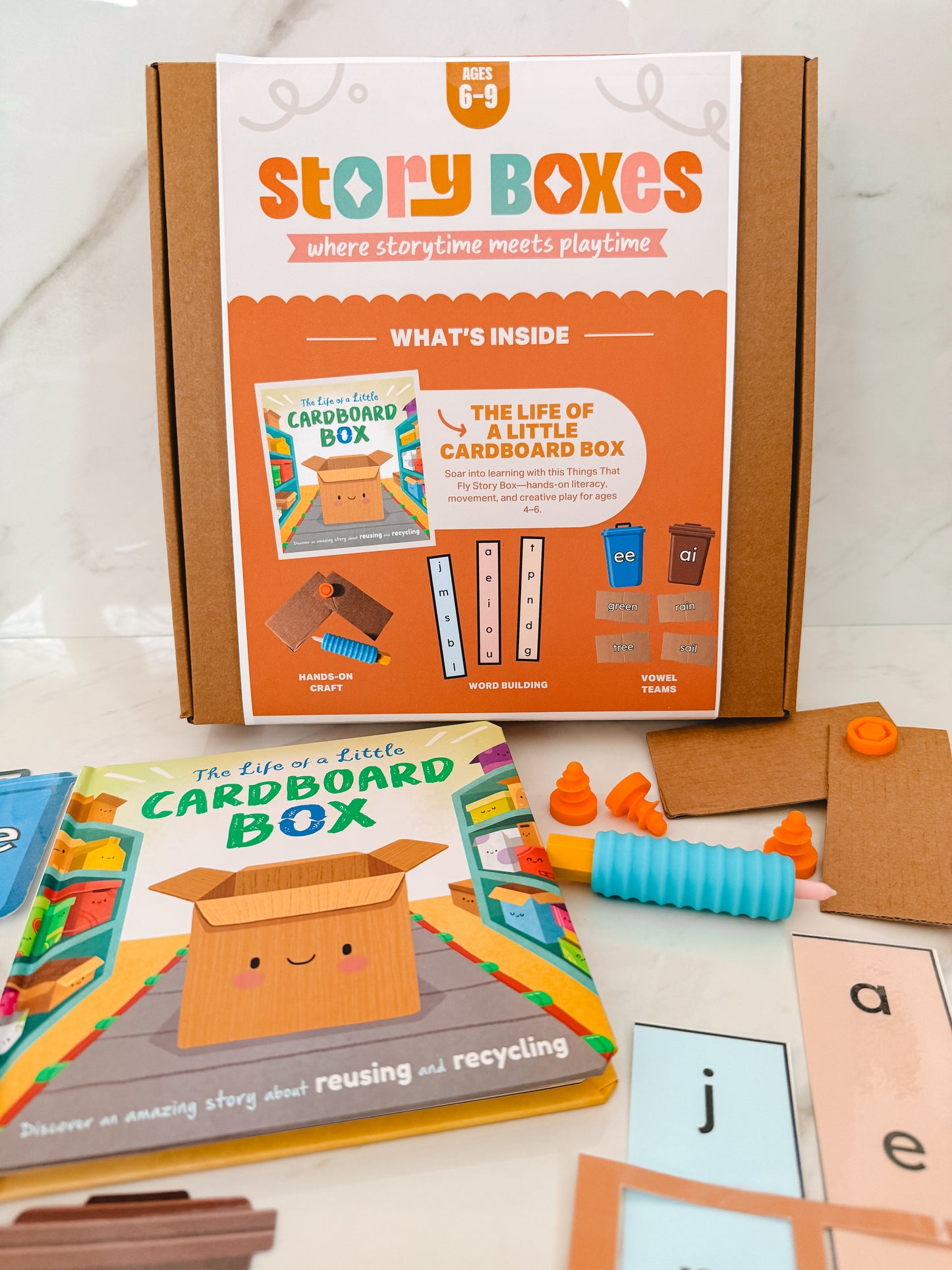 Story Boxes educational product with books and materials on a white background