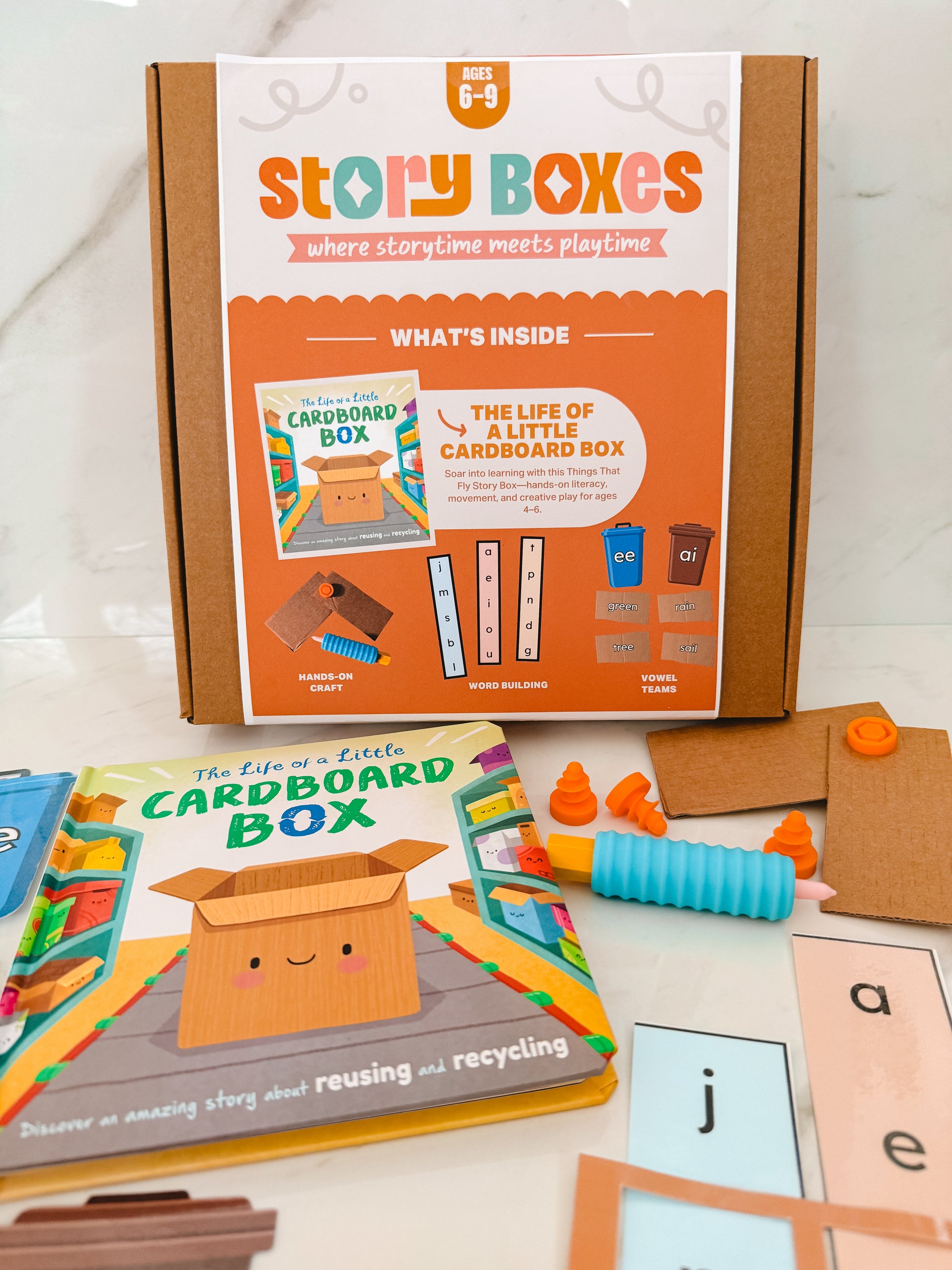 Story Boxes educational product with books and materials on a white background