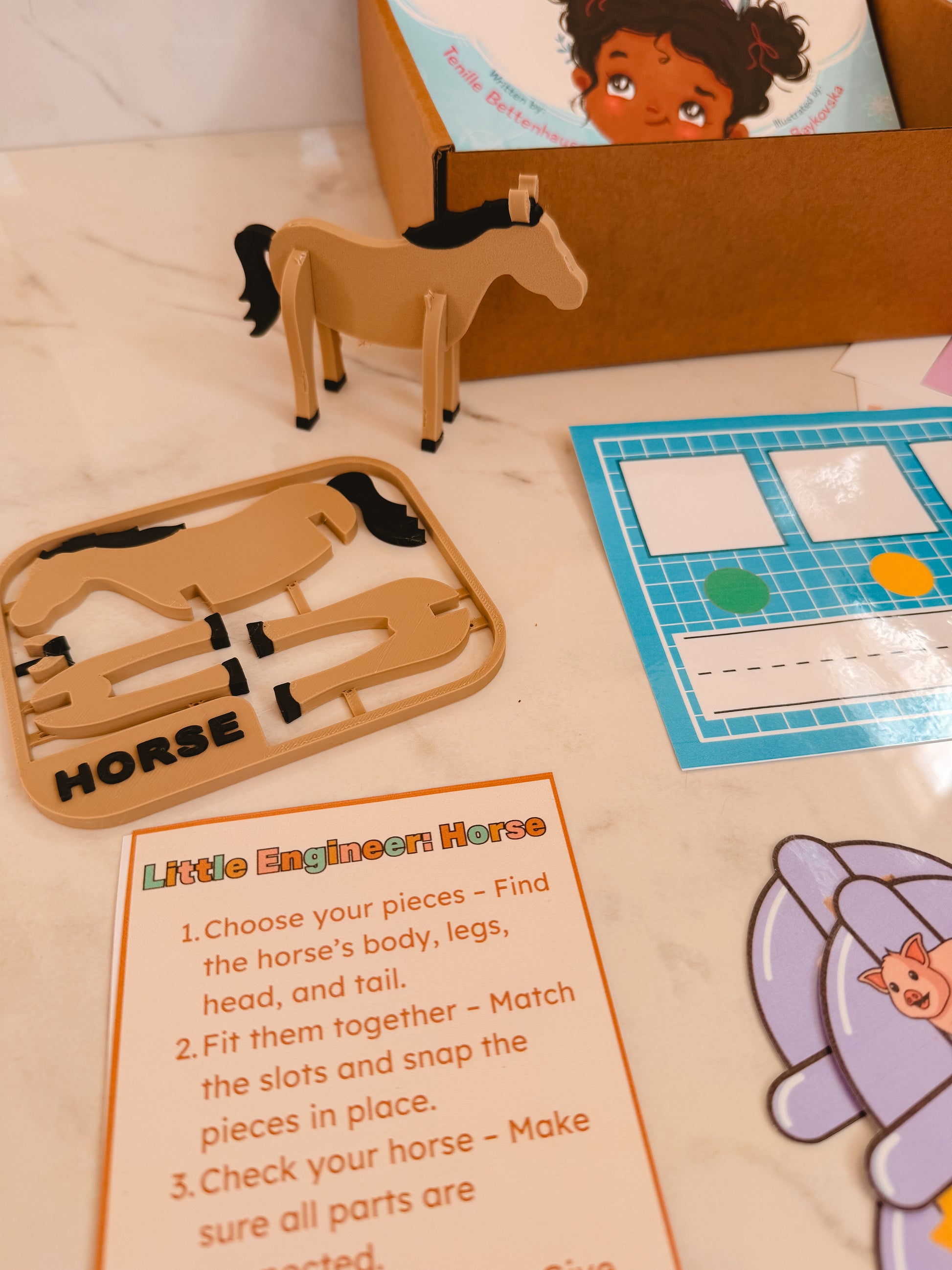 Wooden horse puzzle with instructions on a table