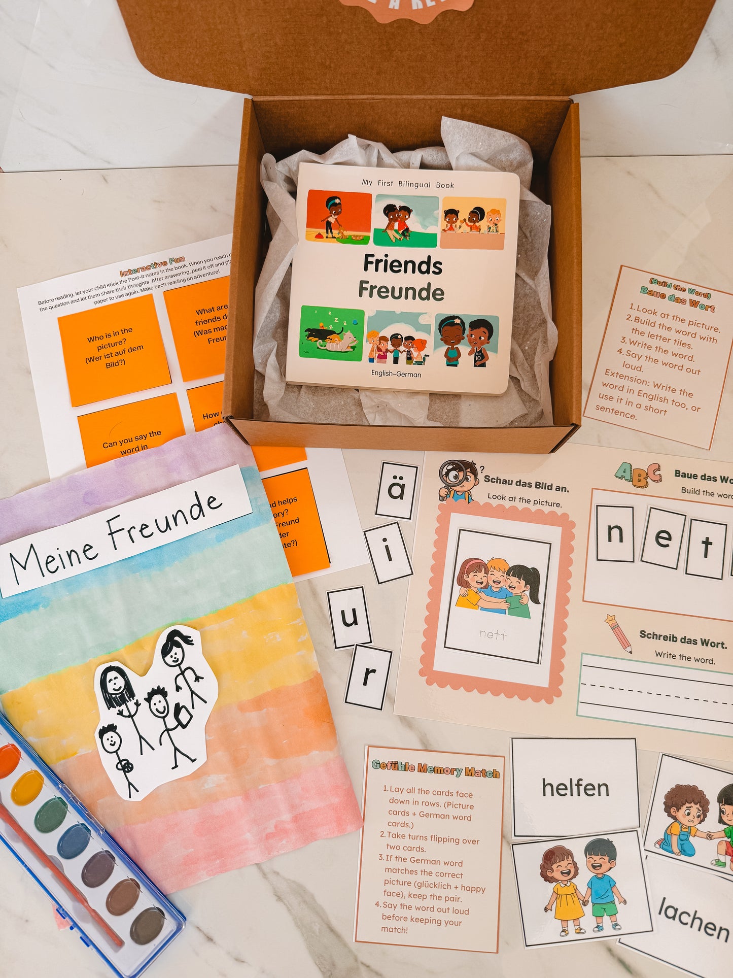 Educational materials including books and flashcards on a wooden surface