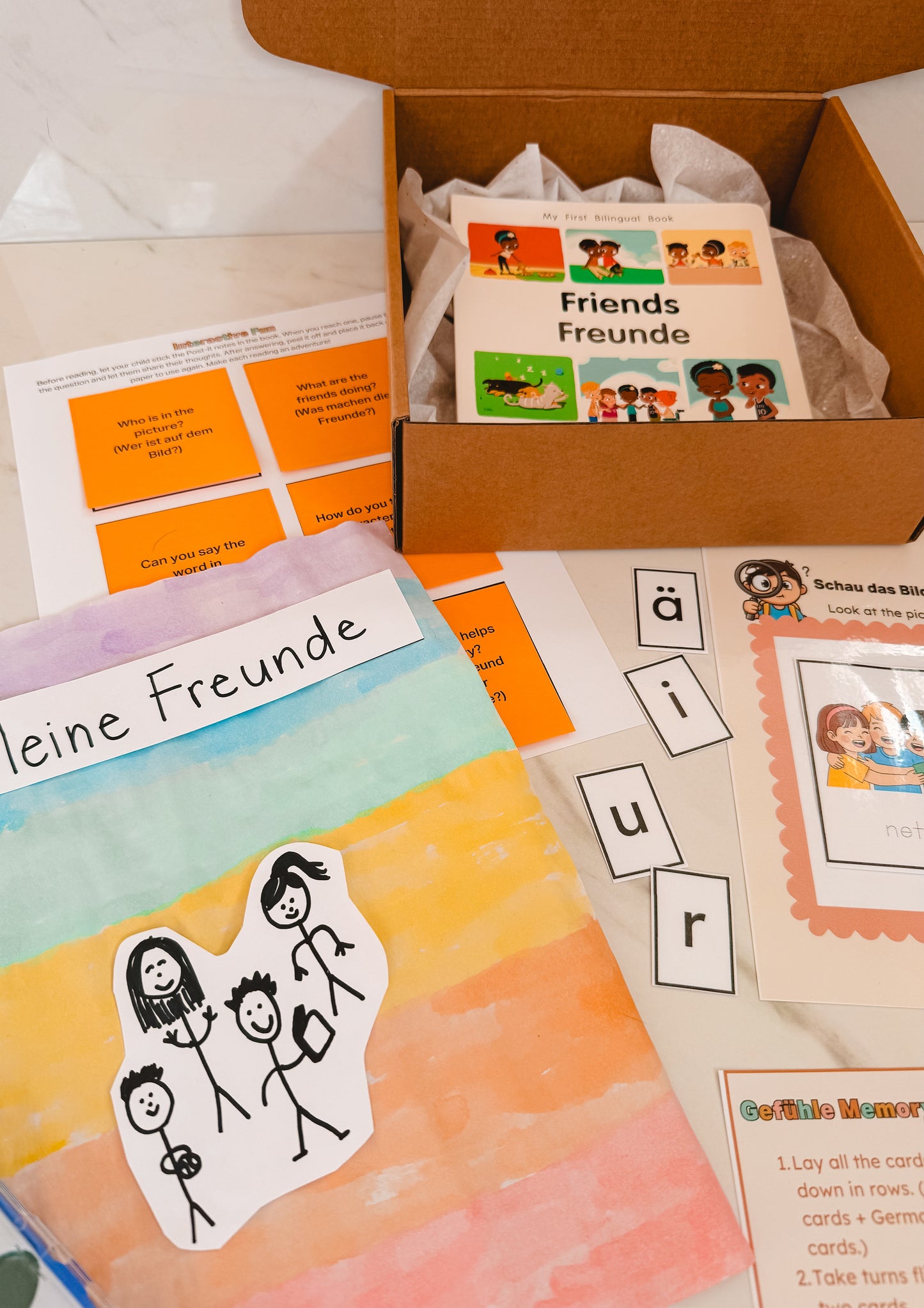 Educational materials including flashcards and a book titled 'Friends' in German, with a focus on language learning.