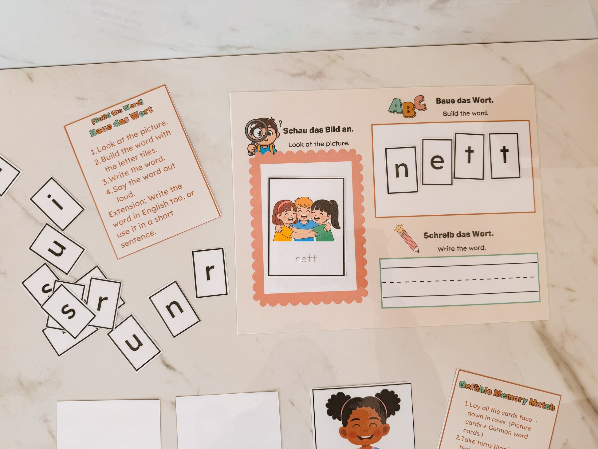 Educational materials with word cards and letter tiles on a wooden surface